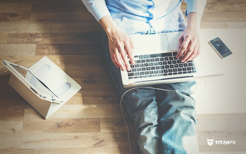 man working remotely on laptop