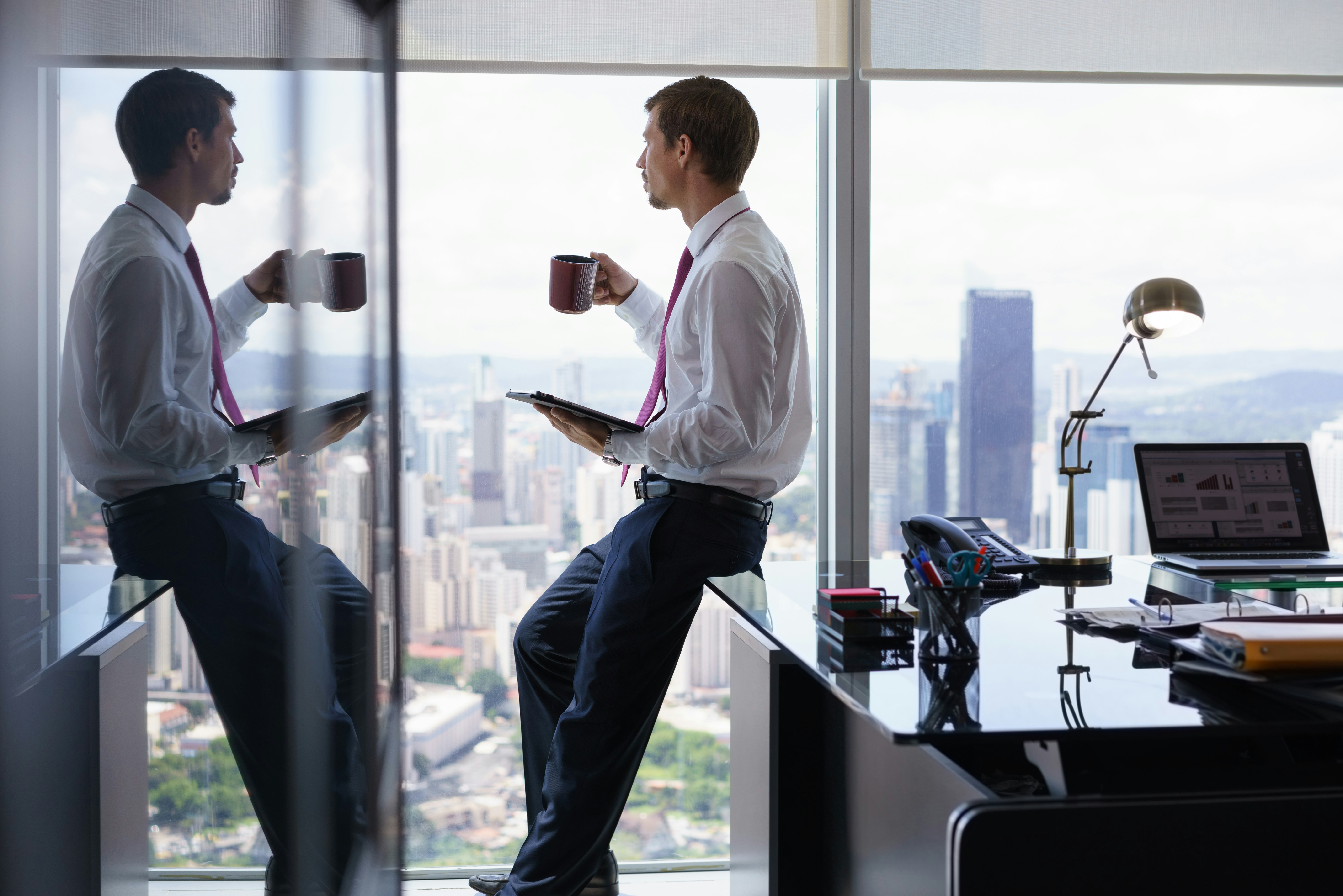 trader sitting on desk